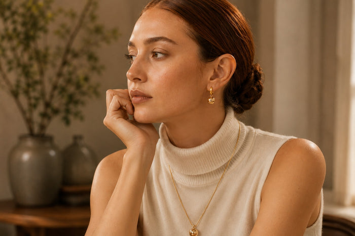 Woman wearing AULUNA jewellery in soft natural light